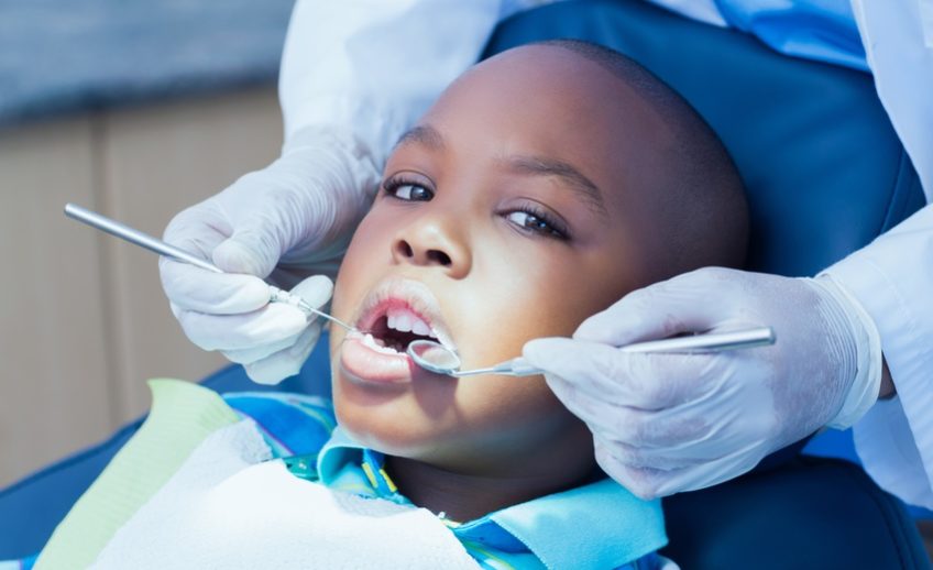 Child receiving Dental sealants